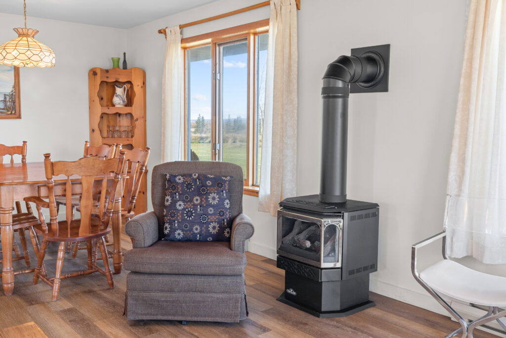 Rocking Chair by a rustic wood stove in Dunes View