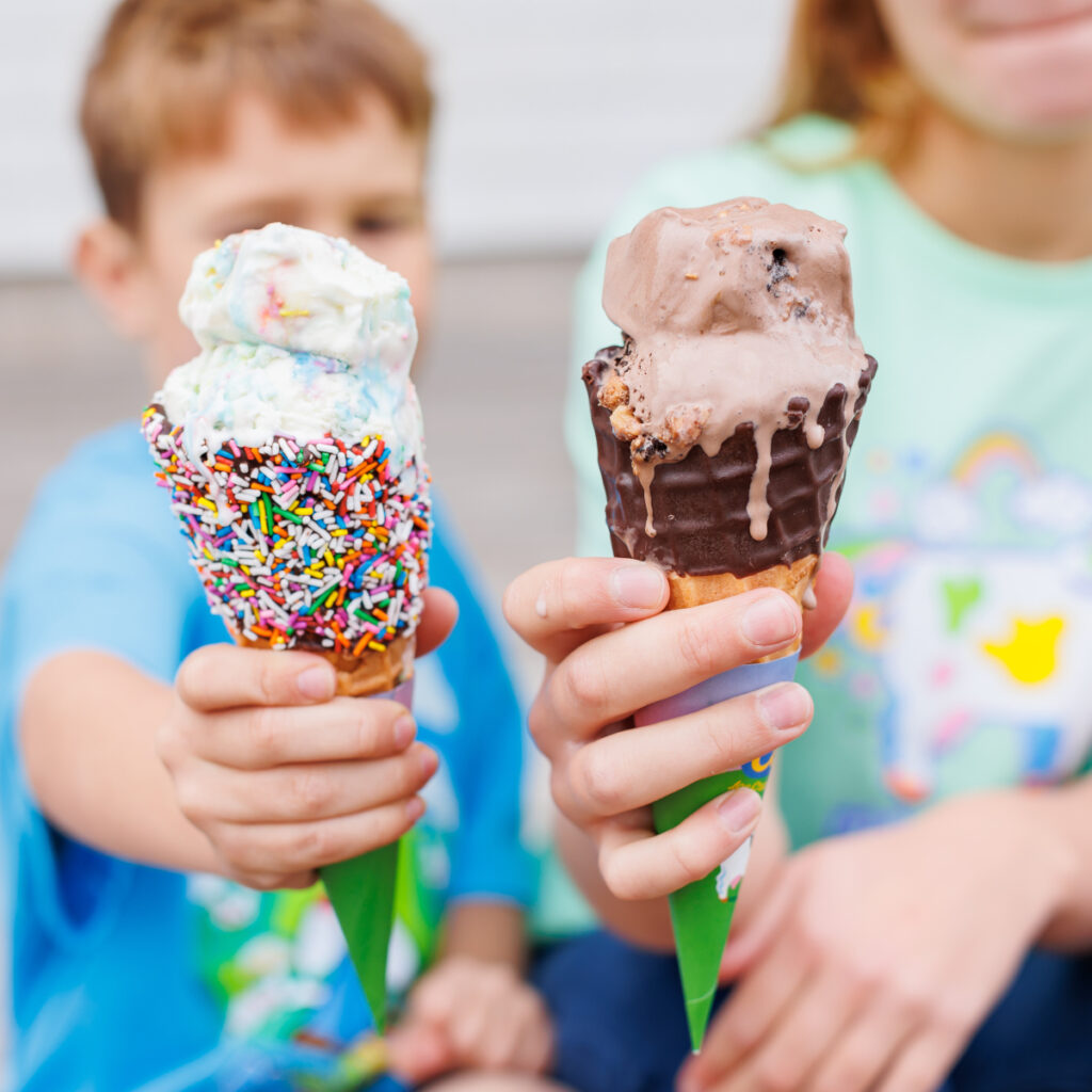 2 kids enjoying COWS Ice Cream